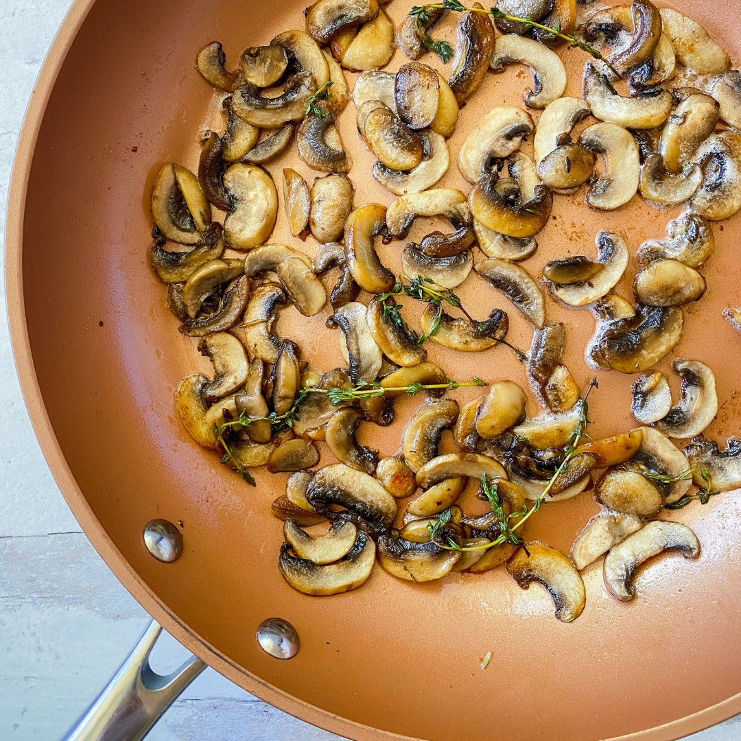 White mushrooms cooked in vegan butter and fresh thyme