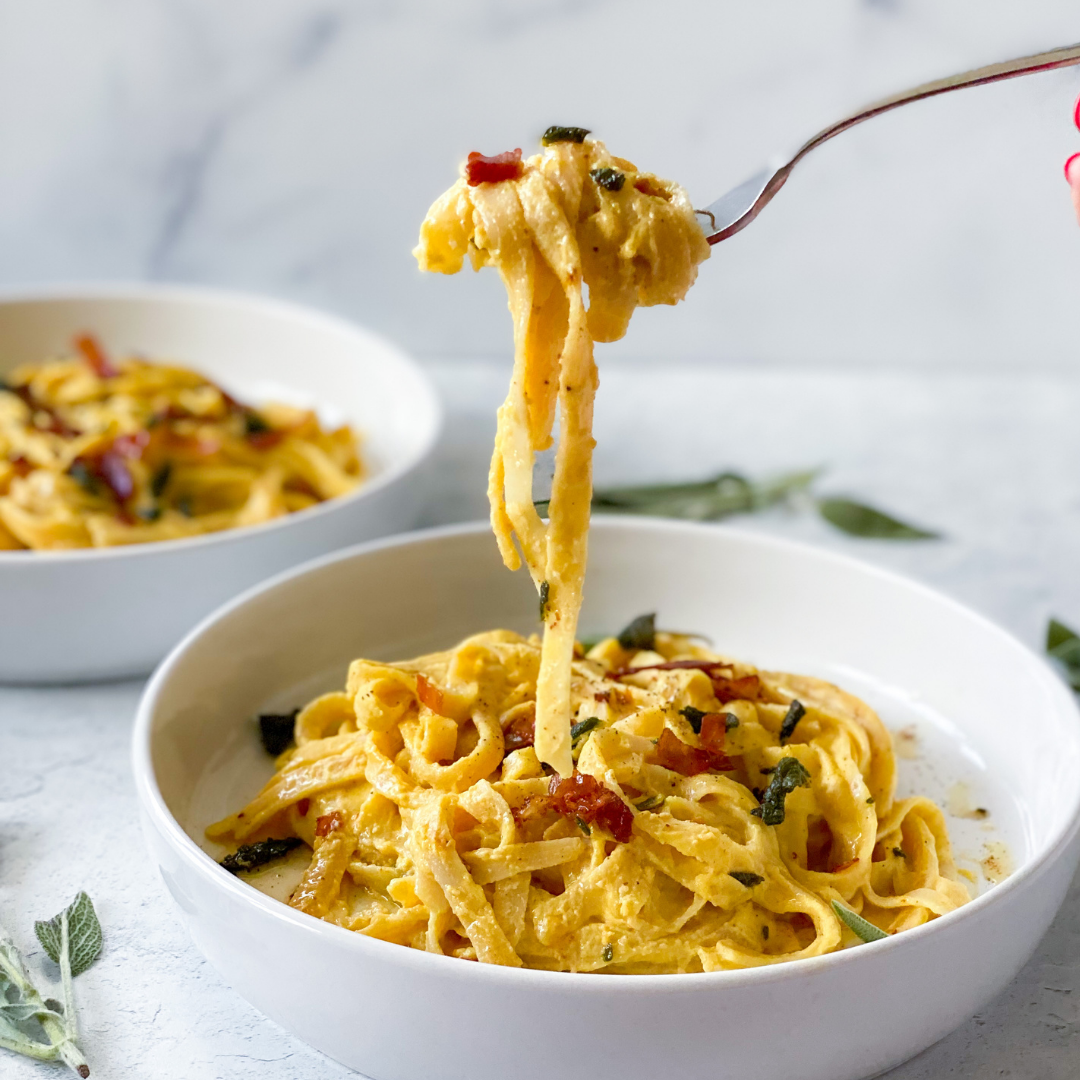 creamy pumpkin pasta sauce with crispy prosciutto and sage butter