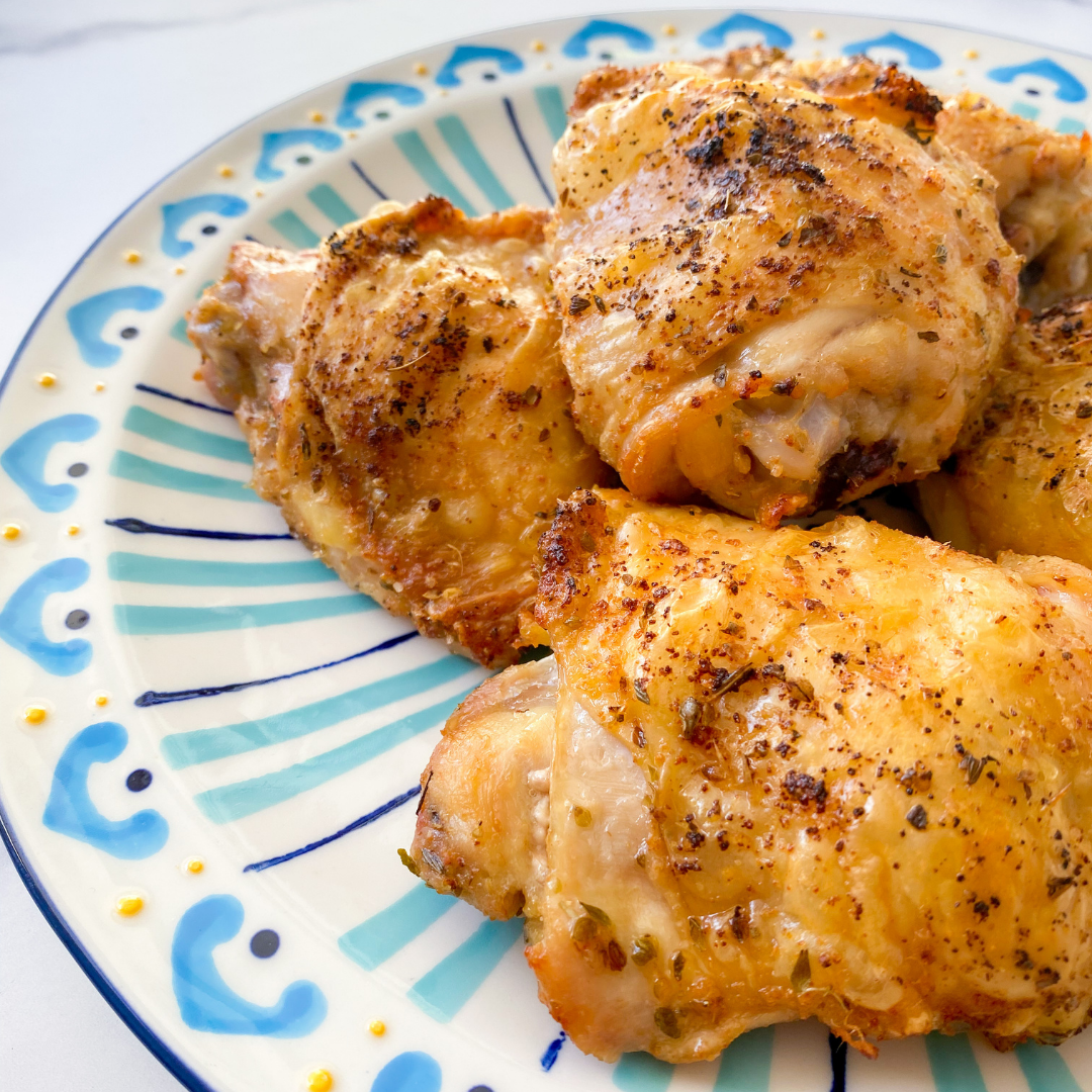 plate of crispy air fryer chicken thighs