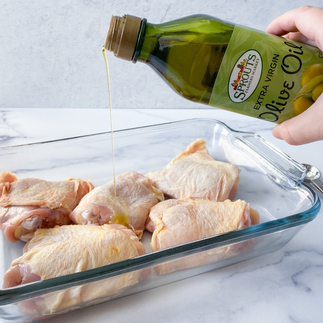 drizzle olive oil on chicken thighs